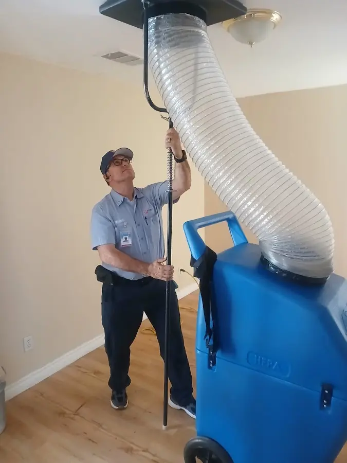 Furnace Tune-Up technician using HEPA equipment in Duncanville
